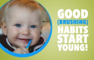 Baby with toothbrush in its mouth